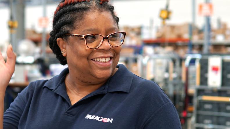 Paragon employee waving and smiling